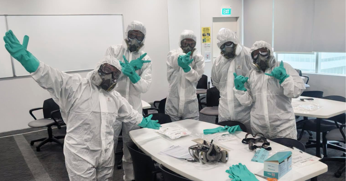 Farhanah and her peers in PPE for a lesson